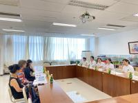 Columbia Nursing faculty meeting with nursing faculty and student in a conference room.